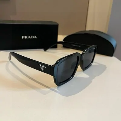 Dark sunglasses beside their case
