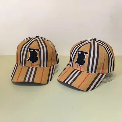 Two tan checked baseball caps