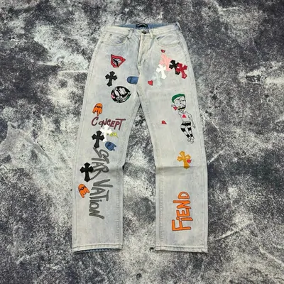 Light jeans with multicolour printed symbols